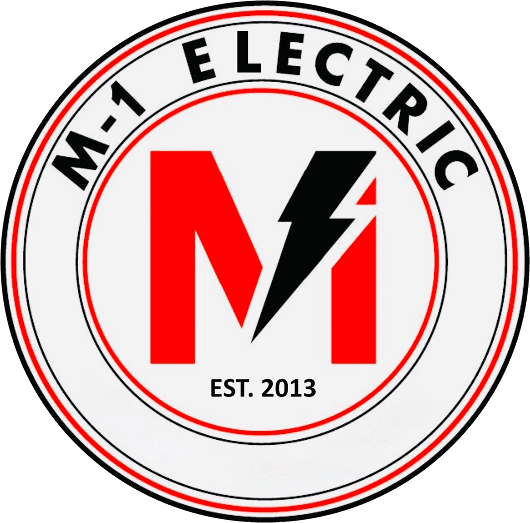 Circular logo for M-1 Electric featuring a large red "M" with a black lightning bolt and the text "EST. 2013" below. The company name is written around the top edge of the circle.